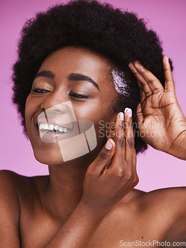 Image of Black woman, hair and smile with afro conditioner, haircare and ethnic texture on pink studio background. African model, cosmetics cream product and scalp relaxer for maintenance, skincare and beauty