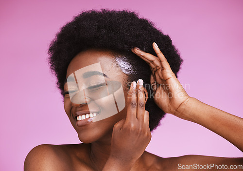 Image of Happy black woman, afro hair and conditioner treatment for ethnic texture on pink studio background. African model, haircare cosmetics and cream product for scalp, skin relaxer and beauty maintenance
