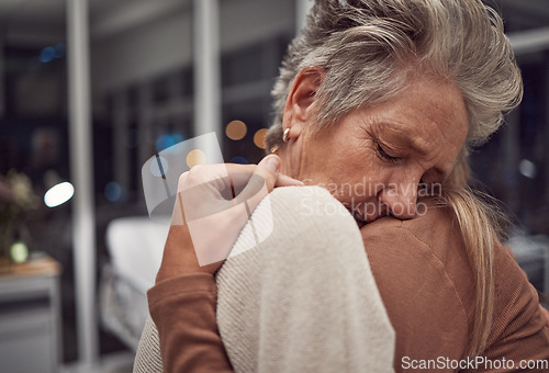 Image of Hug, support and family at hospital to comfort after cancer diagnosis, disease or illness at night. Sad, depression and senior woman and girl hugging, embrace or cuddle for empathy, love and hope.