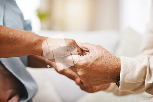 Image of Worship, praying or old couple love holding hands together in a Christian home in retirement with hope or faith. Jesus, senior man and woman in prayer to God for spiritual bonding, help or support