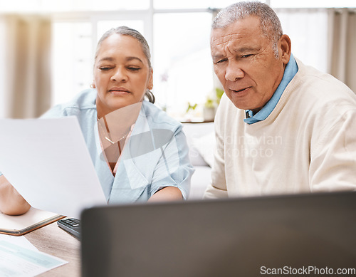 Image of Senior black couple, documents and laptop for planning, budget and taxes with talk for future in home. Old man, woman and reading pc screen for insurance, retirement or finance goals with paperwork