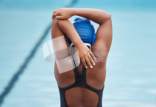 Image of Training, sports and stretching with black woman at swimming pool for health, workout and fitness. Wellness, relax and motivation with arm warm up of athlete for cardio, endurance and exercise goals