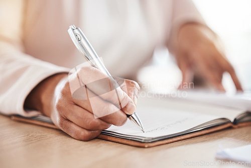 Image of Hands, accountant or woman writing in notebook for financial strategy, tax or audit review for company growth in office. Finance, zoom or advisor for stock market, invest budget or mortgage planning