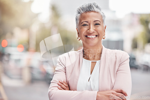 Image of Portrait, city business and woman with arms crossed in Colombia, town and travel commute. Happy manager, mature female and smile in urban street for executive leadership, professional trust and goals