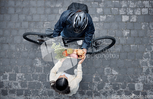 Image of Grocery customer, courier delivery and biker with retail sales product, shopping nutritionist or food shipping container. Logistics supply chain, top view and cycling distribution person with bicycle