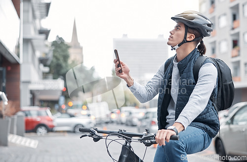 Image of Travel, bike delivery or man with phone in London city, street or road for GPS, location or networking outdoor. Internet, search or male with smartphone for mobile app communication or 5g network