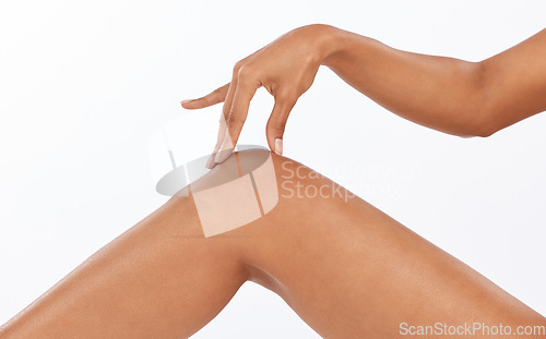 Image of Beauty, epilation and closeup of legs in studio with shaving, hair removal or depilation treatment. Body care, wellness and woman model with moisturizing, skin and health routine by white background.