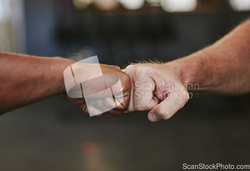 Image of Fist bump, hands and fitness motivation for sports, greeting or team building in gym for wellness. Athlete people, exercise partnership or support, agreement and collaboration, success or teamwork.