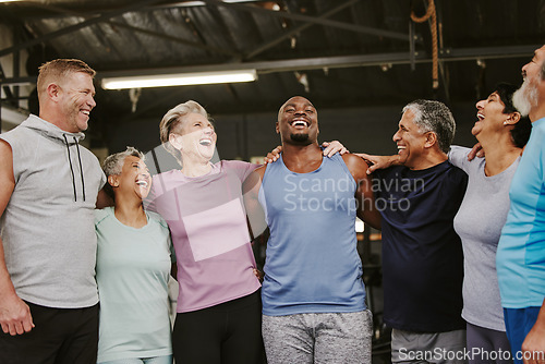 Image of Senior workout group, laugh and personal trainer, smile or support for wellness goal. Elderly women, team building and happy at gym for friends, solidarity and diversity for teamwork motivation hug