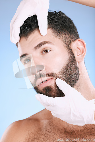 Image of Face, plastic surgery and hands check man for laser, botox implant or beauty clinic. Skincare consultation, facial and gloves of aesthetic change, male cosmetics filler or body prp on blue background