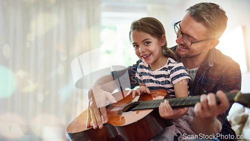 Image of Guitar lesson, girl portrait and musician father at home ready for music teaching and development. Musical knowledge, house and child studying instrument notes with happiness and a smile from parent