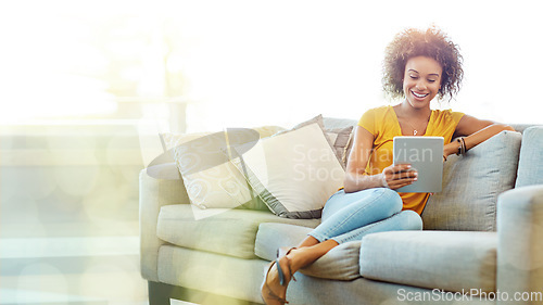 Image of Black woman, tablet and sofa with mockup space with smile, blurred background and happy for meme on app. African gen z girl, home living room and mobile touchscreen in mock up for social network ux