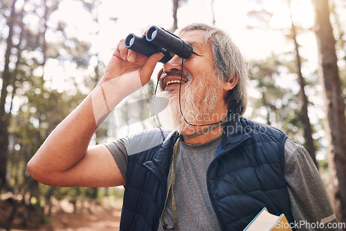 Image of Binoculars, hiking and senior man in nature looking at view, sightseeing or watching. Binocular, adventure search and happy elderly male with field glasses, trekking or exploring on vacation outdoors