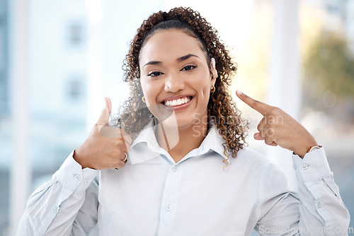 Image of Woman, portrait and thumbs up for hearing aid, auditory treatment or audiologist at health clinic. Happy female with smile showing hand gesture or thumb emoji for listening success, trust or thanks