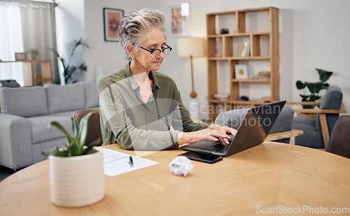 Image of Senior woman, online debt and computer of an elderly person planning retirement savings. Digital budget, paperwork and laptop of an old female reading financial, banking and insurance data or bills