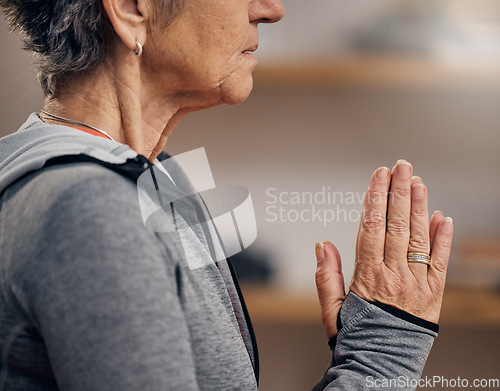 Image of Senior woman, yoga and hands in meditation for spiritual wellness, zen exercise or peace at home. Hand of elderly female meditating in relax for healthy fitness, awareness or namaste in stress relief