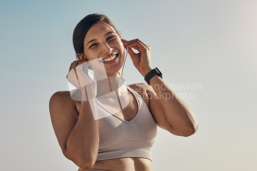 Image of Fitness, portrait and music for woman at a beach for running, training and cardio on sky background. Happy, face and radio for girl on mockup for exercise, wellness and motivation with podcast track