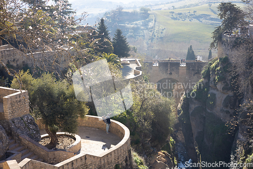 Image of Panoramic view of hanging gardens of Cuenca over El Tajo Gorge with whitewashed houses of Ronda, Andalusia, Spain.