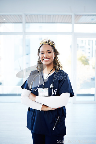 Image of Doctor woman, crown and celebration portrait for career goals, achievement or success for smile in clinic. Happy medic, nurse and arms crossed with stethoscope, award or winning in hospital workplace