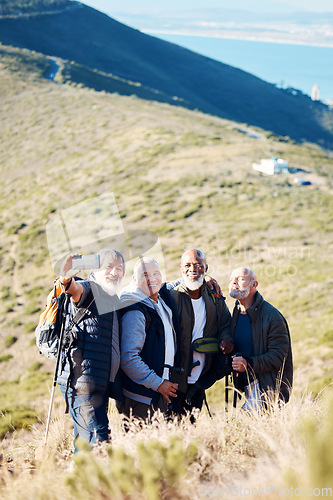 Image of Senior, men and hiking selfie in nature, happy and relax, cheerful and smile on blue field background. Elderly, friends and man hiker group bond with picture, photo and memory of retirement activity