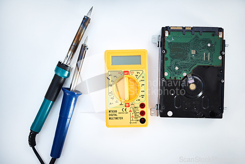 Image of Tools to fix computer parts, hard drive and isolated on white background, technology and engineering in repair workshop. Hardware maintenance, problem diagnosis and machine assembly in empty studio.