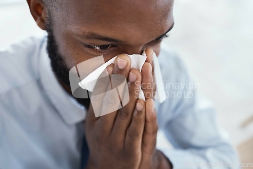 Image of Black man, tissue and blowing nose in business for allergies, sickness and cold virus. Male employee, sick face and sneeze from flu, allergy and health symptoms of sinus, disease and medical risk