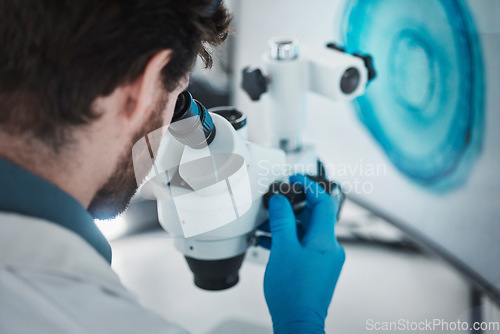 Image of Science, microscope and laboratory with a scientist checking research data from bacteria study. Chemistry lab, biotechnology and back of scientist working on chemical innovation and dna analytics