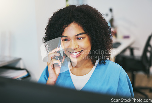 Image of Phone call, happy and woman nurse in the hospital working on a computer for medical reports. Healthcare, technology and professional African female doctor on a mobile conversation in medicare clinic.