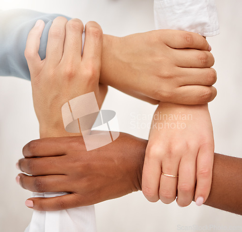 Image of Unity, business team and holding hands for work community, support and teamwork. Team building, diversity and group collaboration motivation of corporate employees with solidarity and hope together