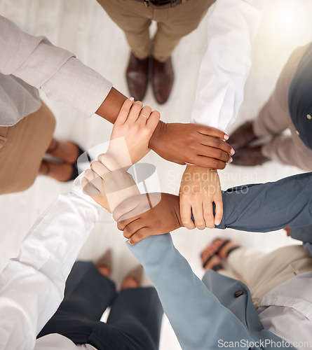 Image of Team, business people and holding hands for work community, support and teamwork. Team building, diversity and group collaboration motivation of corporate employees with solidarity and hope together