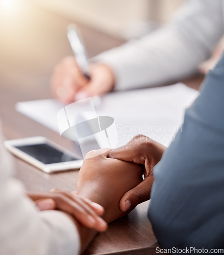 Image of Holding hands, black couple and contract of people in a life insurance meeting with solidarity. Marriage support, love and care busy with documents for healthcare agreement and policy deal at desk