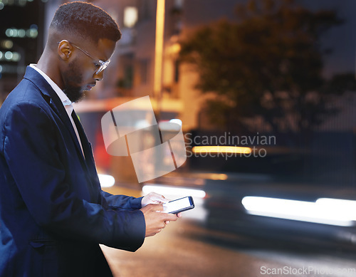 Image of Phone, business and black man in city at night, street or outdoors in town for texting. 5g mockup, technology and male employee with smartphone for social media, internet browsing or web scrolling.