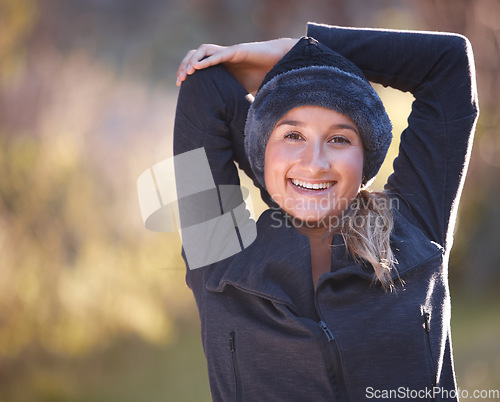 Image of Hiking, portrait and mock up with a woman stretching outdoor for a hike in the woods, forest or nature. Fitness, warm up and a female hiker getting ready for a walk outside in the natural wilderness