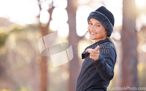 Image of Fitness, nature and portrait of a woman pointing while walking, training or running in Norway. Motivation, choice and girl in the mountains for exercise, hiking or morning cardio with mockup space