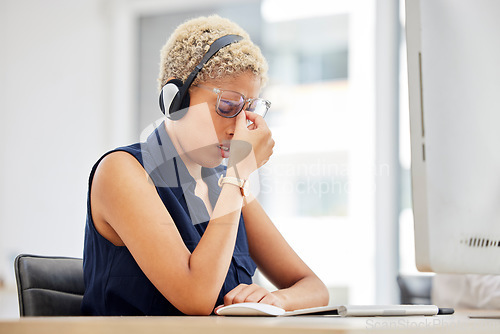 Image of Stress, headache or black woman in call center with burnout, fatigue or migraine pain at customer services. Tired, depression or sick consultant in a telemarketing or telecom communications company