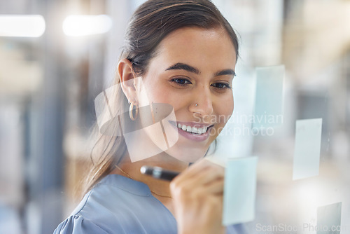 Image of Strategy, planning and woman writing an idea, schedule or agenda on a sticky note board at work. Goal, creative and employee with an agenda, brainstorming and vision with project management notes