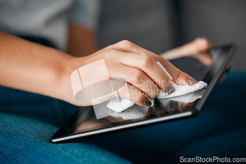 Image of Woman hands, tablet and cleaning screen for dust, dirt risk and bacteria safety in home. Female, girl and device disinfection with microfiber cloth, surface care and hygiene of technology for health