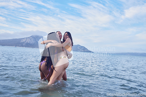 Image of Sea, mockup and woman friends hugging outdoor together in nature during summer vacation or holiday. Beach, water or sky with a female friend group wet in the ocean during a hug for happy bonding