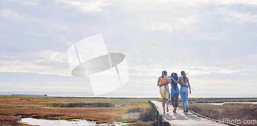 Image of Relax, happy and boardwalk with friends at beach for travel vacation, support or summer break with sky mockup. Diversity, holiday and nature with women walking together for bonding, hug or peace