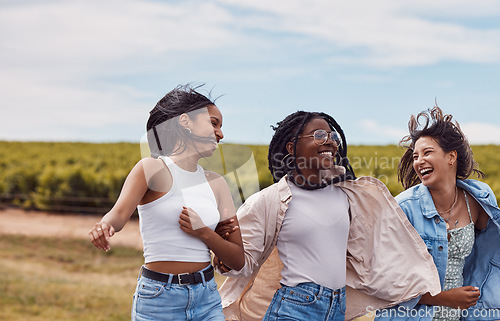 Image of Women, friends and countryside for outdoor adventure, holiday and together for summer sunshine. Group, happy black woman and gen z students on vacation with comic laugh, support and walking in nature