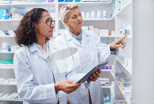 Image of Tablet, teamwork and pharmacists check stock in pharmacy, drugstore or shop for medication. Medicine, technology and medical doctors or senior women with touchscreen for checking product inventory.