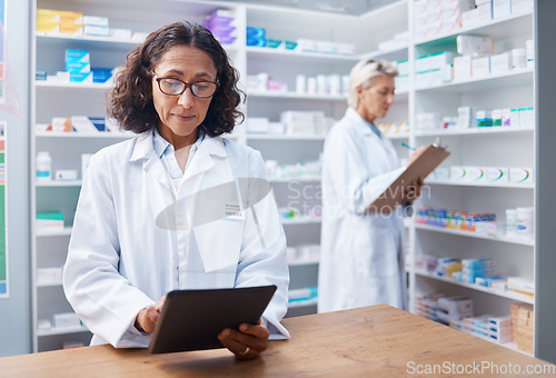 Image of Senior woman, tablet and pharmacist in pharmacy for healthcare, telehealth or stock check. Medicine shop, technology and female medical doctor with touchscreen for research or online consultation.