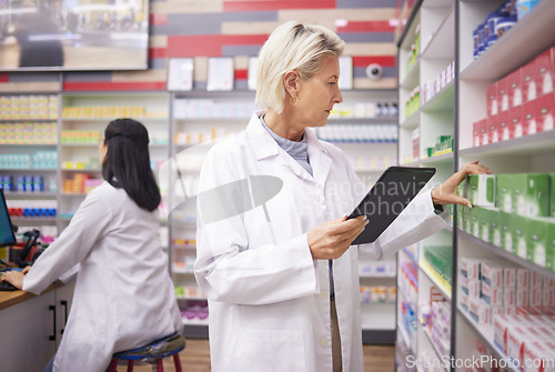 Image of Pharmacy product, pharmacist woman and tablet for medicine management, stock research or inventory. Digital technology, retail logistics and senior medical doctor or person on pharmaceutical database