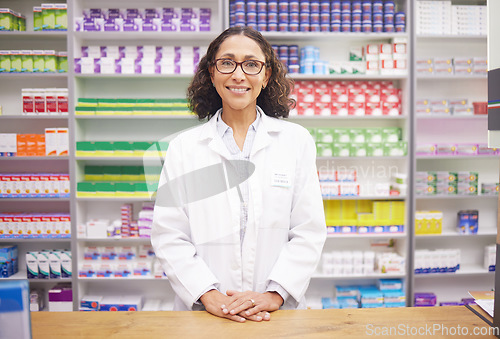 Image of Pharmacy, pills and portrait of a woman pharmacist ready for customer service. Pharmaceutical store, medicine inventory and healthcare drug shelves with a happy employee feeling proud of dispensary