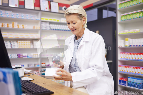 Image of Pharmacy, smile and woman scanning medicine at checkout counter for prescription drugs. Healthcare, pills and certified senior pharmacist with medical product in box and digital scanner in drugstore.