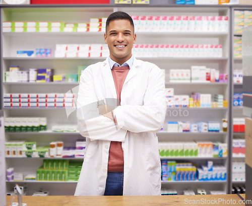Image of Pharmacy, smile and confidence, portrait of man at drugstore counter, customer service and medical advice in Brazil. Prescription drugs, pharmacist and inventory of pills and medicine at checkout.
