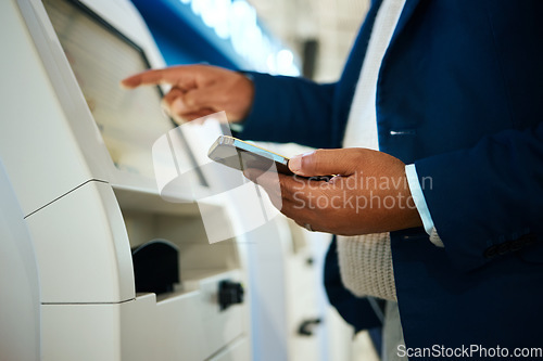 Image of Hand, phone and atm with a business black man at the bank to withdraw cash from a convenient machine. Money, finance and smartphone with a male employee making a financial transaction on credit