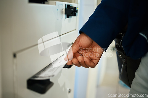 Image of Hands, ticket and airport at self service machine for check in, flight or boarding pass to travel. Hand of traveler taking plane tickets for traveling, trip or journey at airline auto terminal