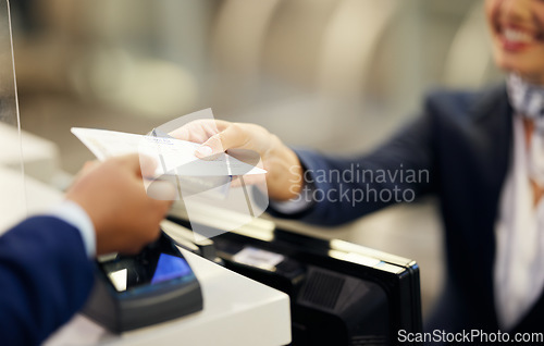 Image of Hands, airport and passenger assistant with ticket, passport or documents to board plane at terminal counter. Hand of female service agent giving access for travel, security or immigration papers