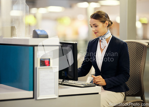 Image of Airport, check in desk and woman on computer for security, travel agent or transport management. Airplane concierge, customer service and ticket help of global booking, journey or flight receptionist